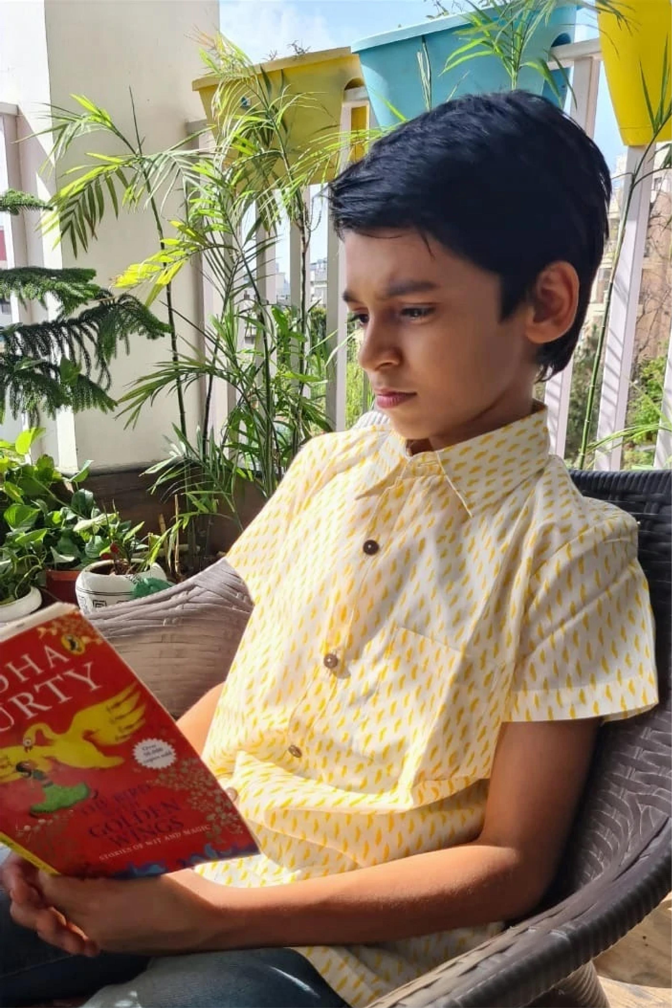 Boy Waves Yellow Shirt