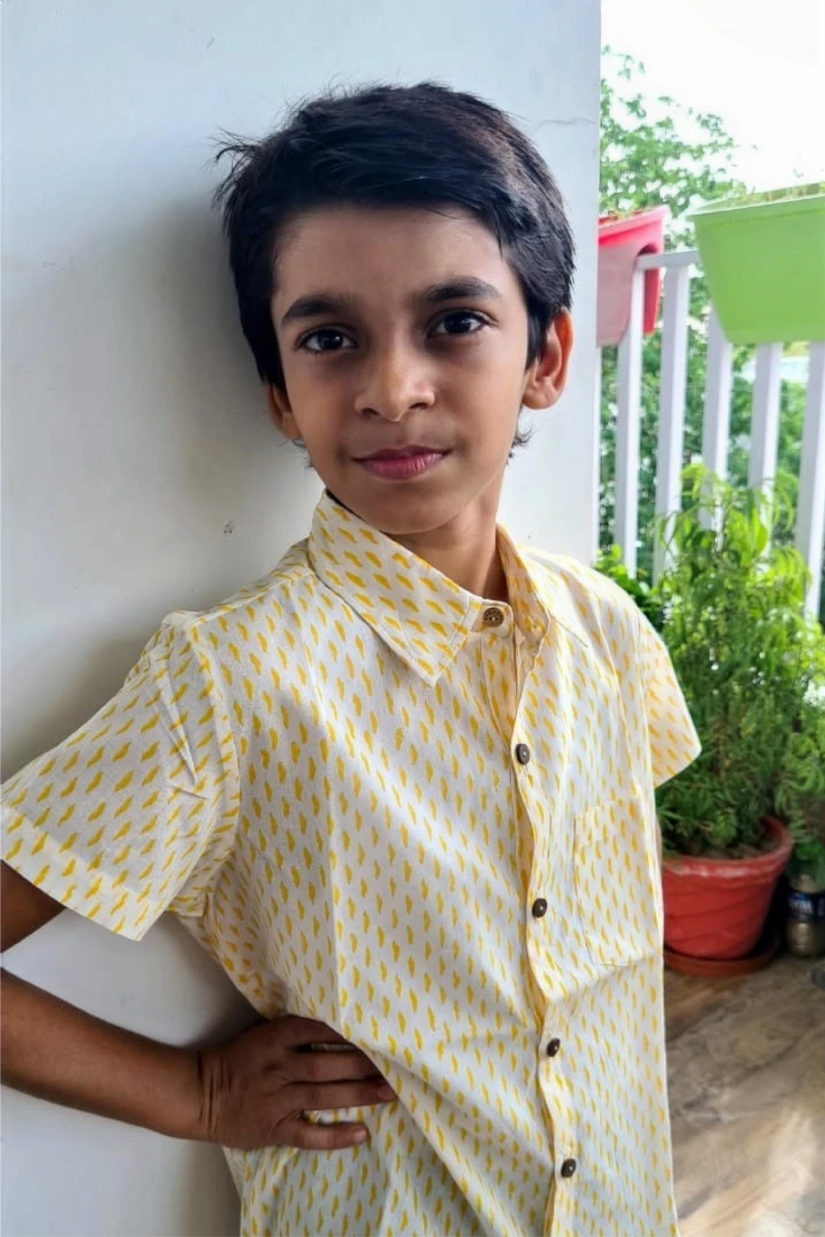 Boy Waves Yellow Shirt